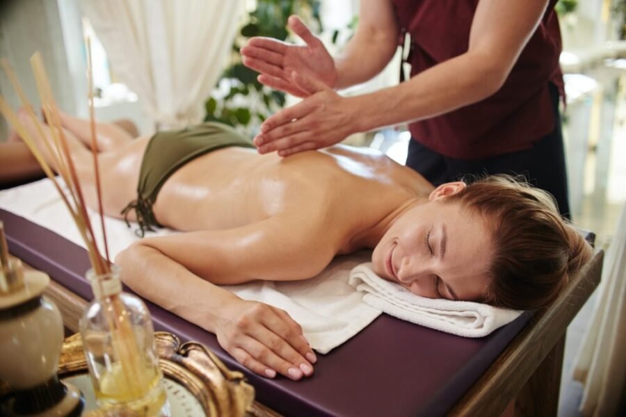 smiling-woman-enjoying-massage-in-spa-e1751798917770